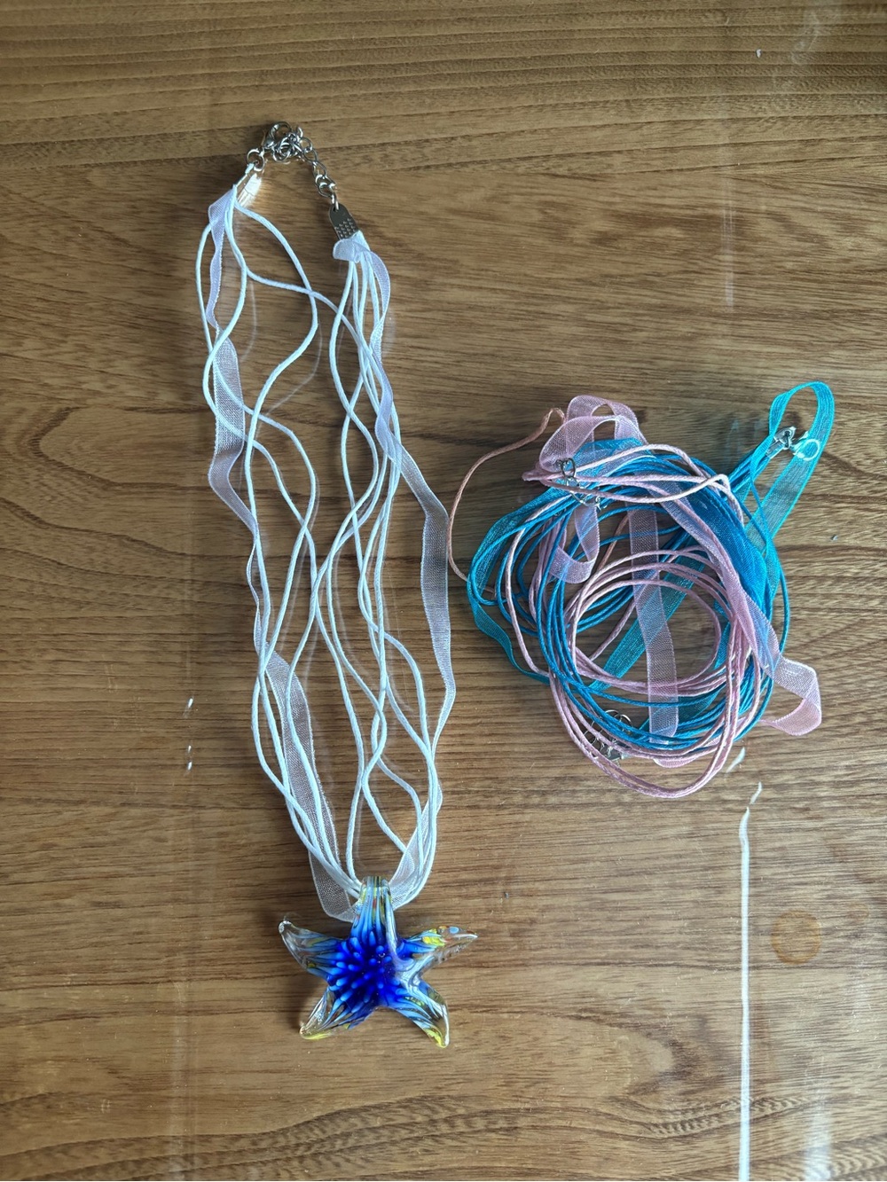 Blue Glass Starfish Pendant Necklace with White Ribbon Strands